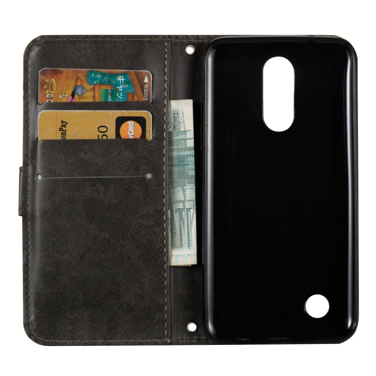 For LG K4 (2017) (US Version) Skull Pressed Flowers Pattern Horizontal Flip Leather Case with Holder & Card Slots & Wallet & Lanyard