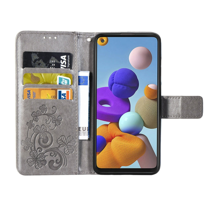 For Samsung Galaxy A21s Four-leaf Clasp Embossed Buckle Mobile Phone Protection Leather Case with Lanyard & Card Slot & Wallet & Bracket Function
