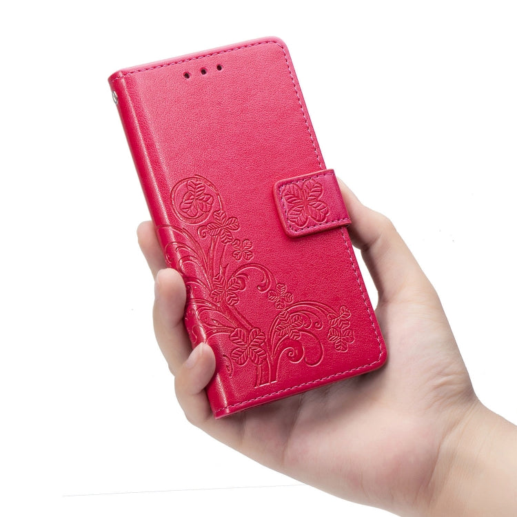 For Samsung Galaxy A21s Four-leaf Clasp Embossed Buckle Mobile Phone Protection Leather Case with Lanyard & Card Slot & Wallet & Bracket Function