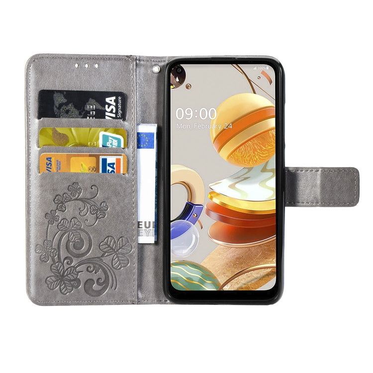 For LG K61 Four-leaf Clasp Embossed Buckle Mobile Phone Protection Leather Case with Lanyard & Card Slot & Wallet & Bracket Function