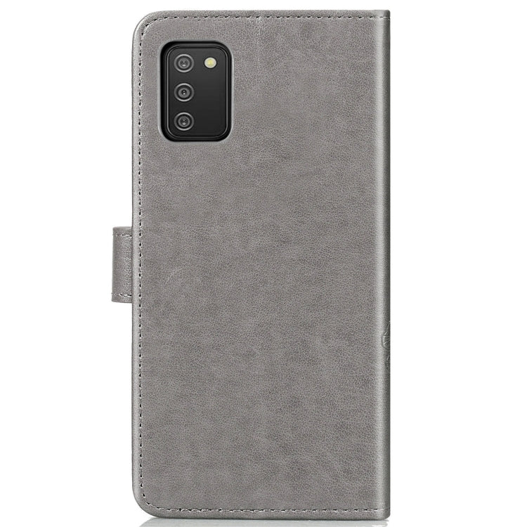 For Samsung Galaxy A02s (EU Version) Four-leaf Clasp Embossed Buckle Mobile Phone Protection Leather Case with Lanyard & Card Slot & Wallet & Bracket Function