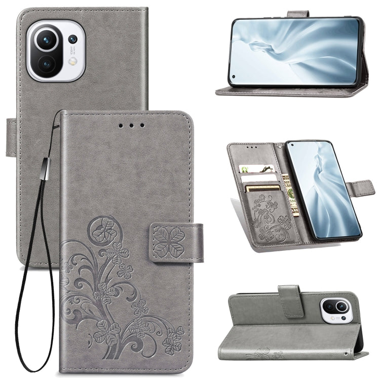 For Xiaomi Mi 11 Four-leaf Clasp Embossed Buckle Mobile Phone Protection Leather Case with Lanyard & Card Slot & Wallet & Bracket Function