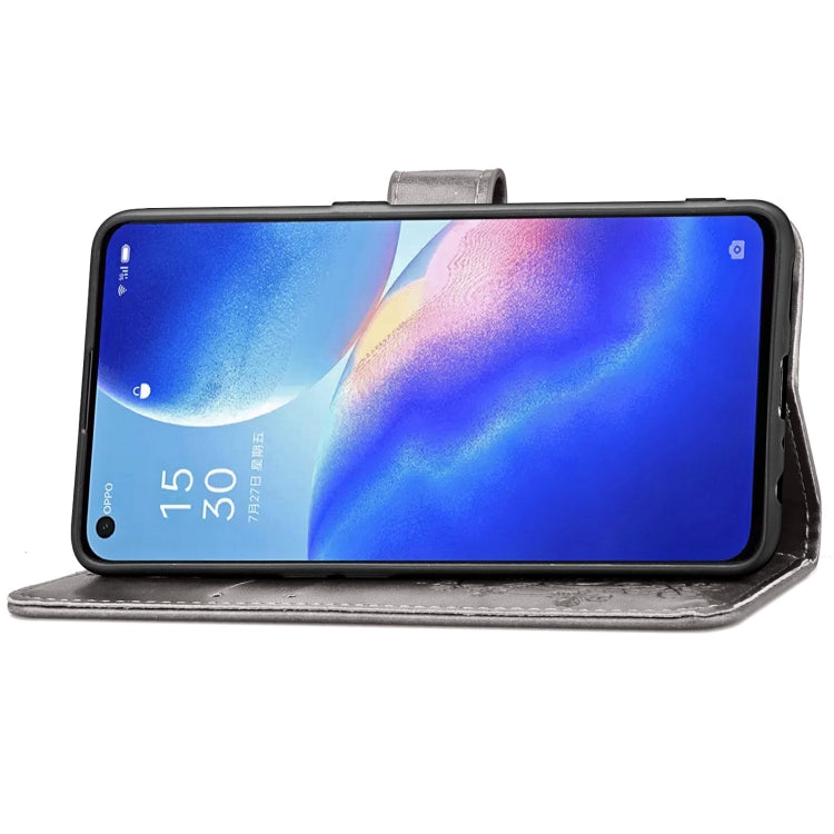 For OPPO Reno5 5G Four-leaf Clasp Embossed Buckle Leather Phone Case with Lanyard & Card Slot & Wallet & Holder