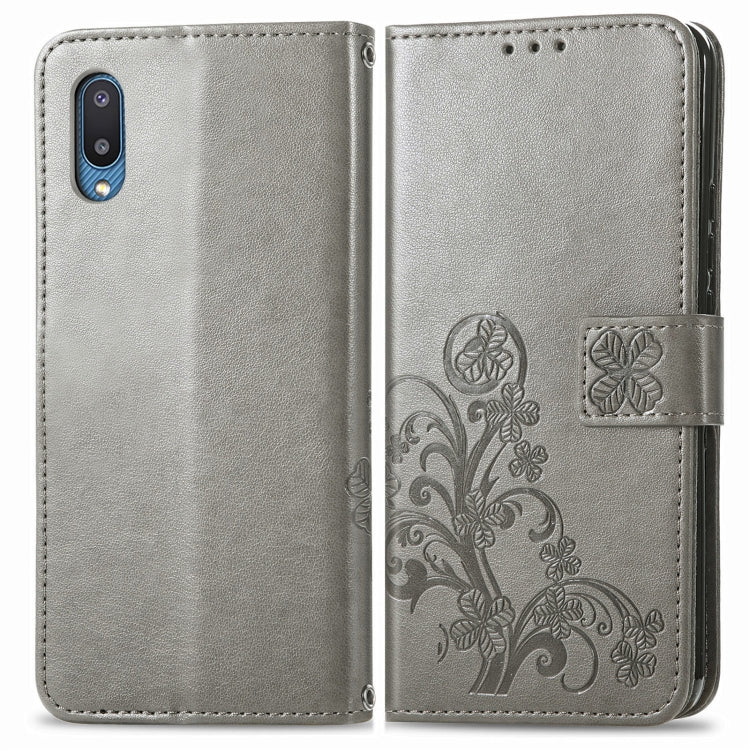 For Samsung Galaxy A02 Four-leaf Clasp Embossed Buckle Mobile Phone Protection Leather Case with Lanyard & Card Slot & Wallet & Bracket Function