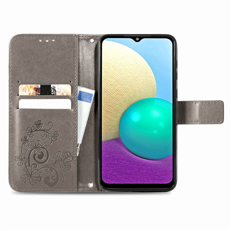 For Samsung Galaxy A02 Four-leaf Clasp Embossed Buckle Mobile Phone Protection Leather Case with Lanyard & Card Slot & Wallet & Bracket Function