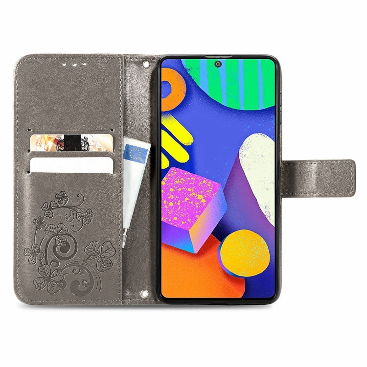 For Samsung Galaxy F62/M62 Four-leaf Clasp Embossed Buckle Mobile Phone Protection Leather Case with Lanyard & Card Slot & Wallet & Bracket Function