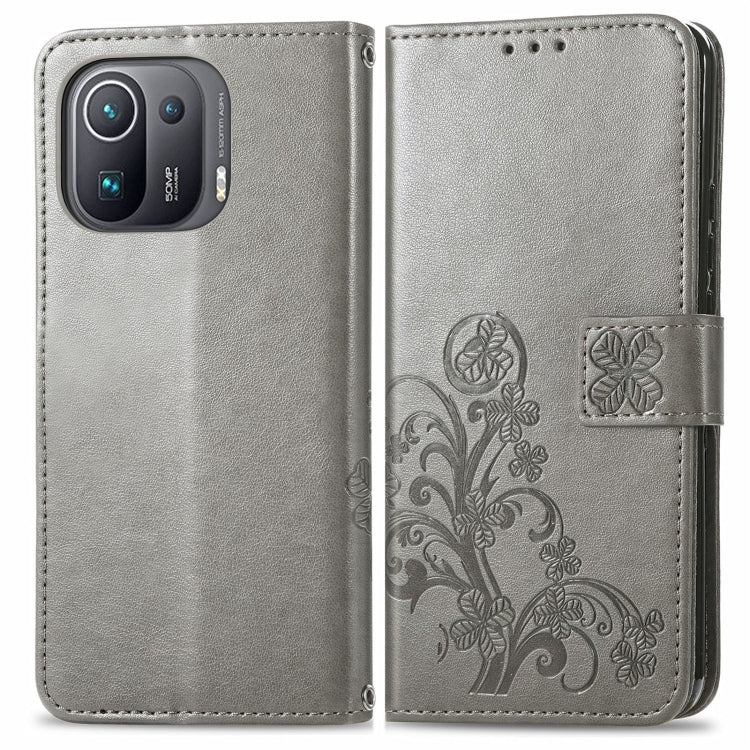 For Xiaomi Mi 11 Pro Four-leaf Clasp Embossed Buckle Mobile Phone Protection Leather Case with Lanyard & Card Slot & Wallet & Bracket Function