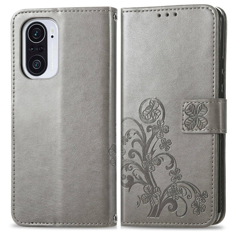 For Xiaomi Redmi K40 / K40 Pro Four-leaf Clasp Embossed Buckle Mobile Phone Protection Leather Case with Lanyard & Card Slot & Wallet & Bracket Function