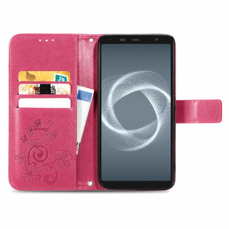 For FUJITSU F-41B Four-leaf Clasp Embossed Buckle Mobile Phone Protection Leather Case with Lanyard & Card Slot & Wallet & Bracket Function