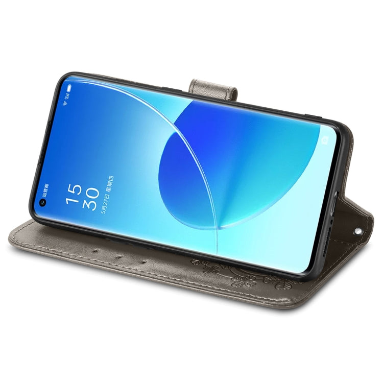 For OPPO Reno6 Pro Four-leaf Clasp Embossed Buckle Mobile Phone Protection Leather Case with Lanyard & Card Slot & Wallet & Bracket Function