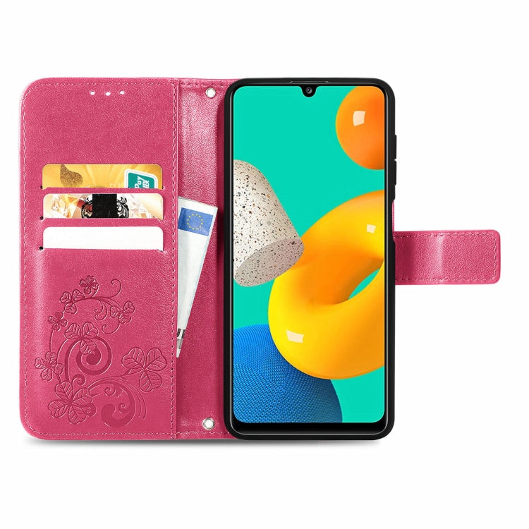 For Samsung Galaxy M32 Four-leaf Clasp Embossed Buckle Mobile Phone Protection Leather Case with Lanyard & Card Slot & Wallet & Bracket Function