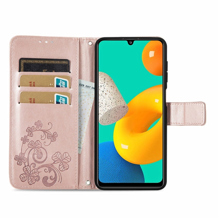 For Samsung Galaxy M32 Four-leaf Clasp Embossed Buckle Mobile Phone Protection Leather Case with Lanyard & Card Slot & Wallet & Bracket Function