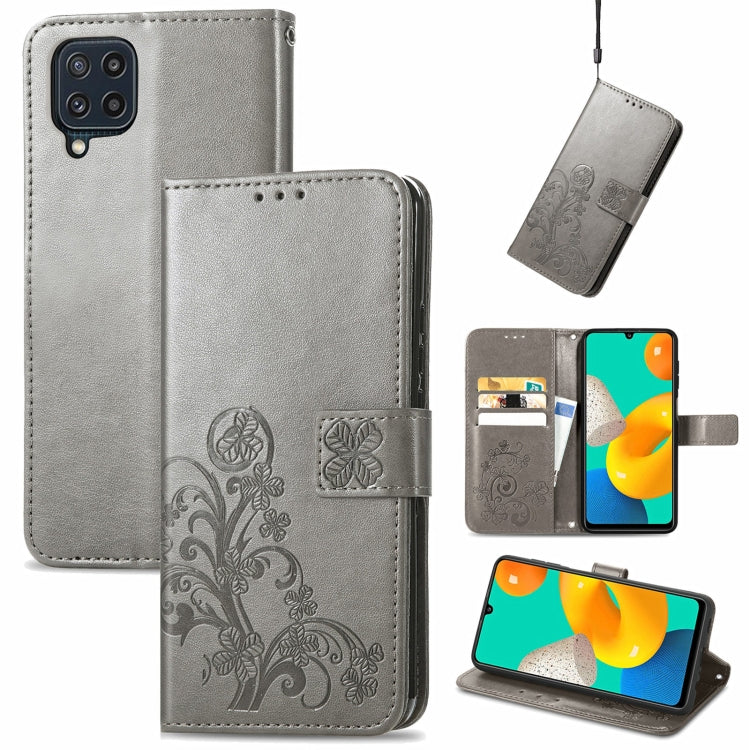 For Samsung Galaxy M32 Four-leaf Clasp Embossed Buckle Mobile Phone Protection Leather Case with Lanyard & Card Slot & Wallet & Bracket Function