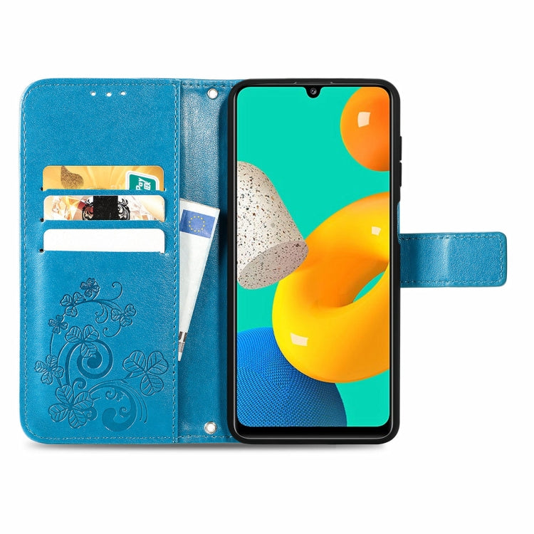 For Samsung Galaxy M32 Four-leaf Clasp Embossed Buckle Mobile Phone Protection Leather Case with Lanyard & Card Slot & Wallet & Bracket Function