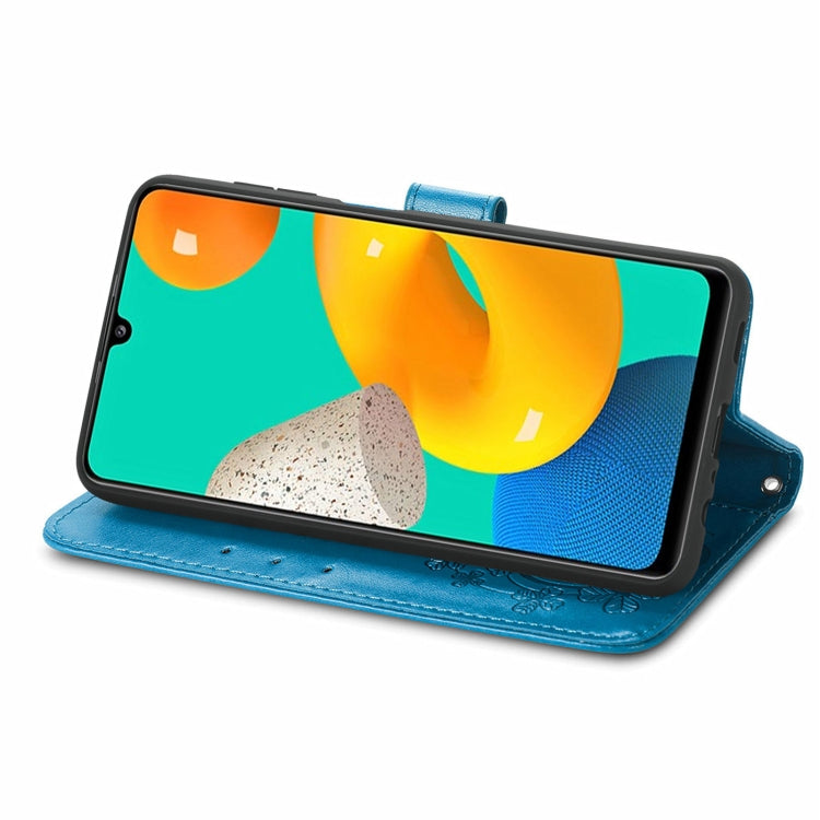 For Samsung Galaxy M32 Four-leaf Clasp Embossed Buckle Mobile Phone Protection Leather Case with Lanyard & Card Slot & Wallet & Bracket Function