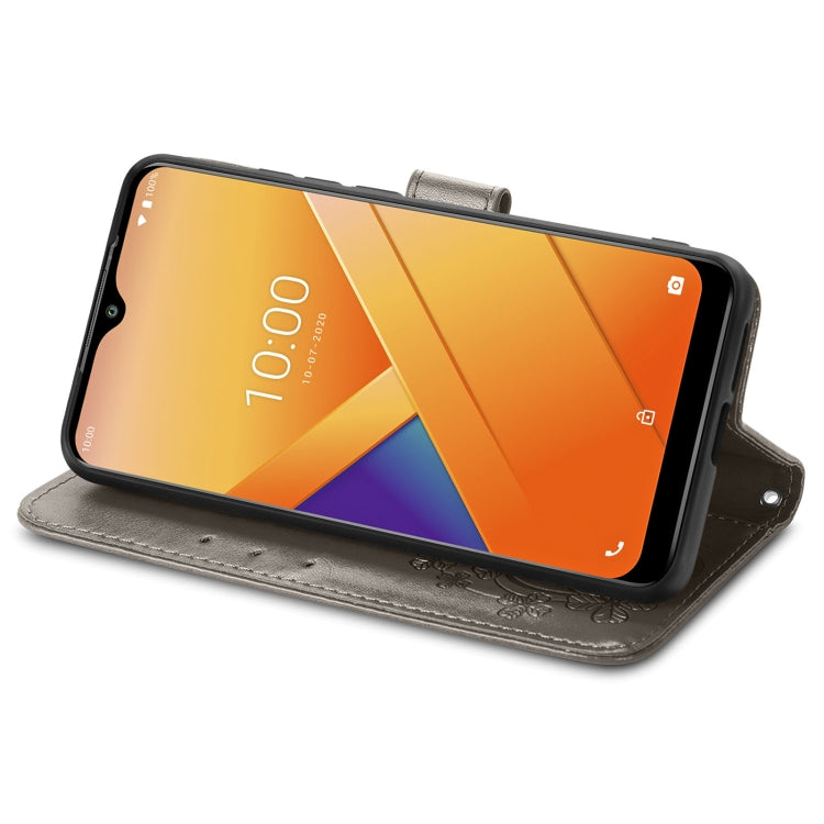 For Wiko Y81 Four-leaf Clasp Embossed Buckle Mobile Phone Protection Leather Case with Lanyard & Card Slot & Wallet & Bracket Function