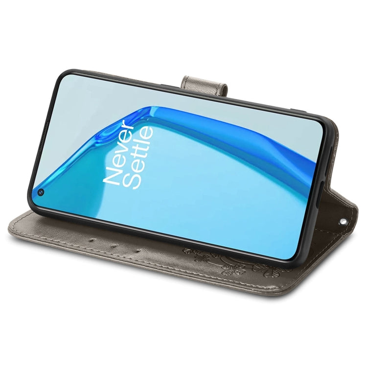 For OnePlus 9R Four-leaf Clasp Embossed Buckle Mobile Phone Protection Leather Case with Lanyard & Card Slot & Wallet & Bracket Function