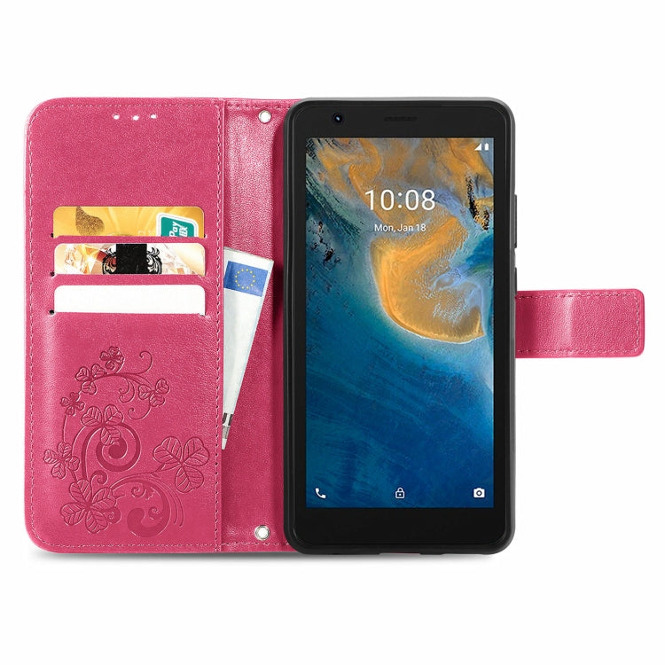 For ZTE Blade A31 Lite Four-leaf Clasp Embossed Leather Case with Lanyard & Card Slot & Wallet & Holder
