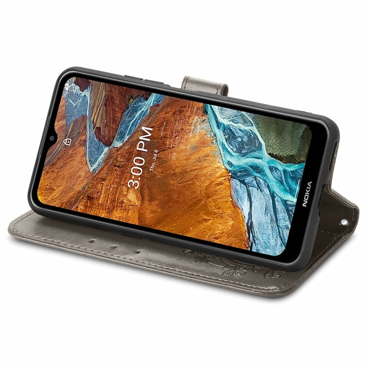 For Nokia G300 Four-leaf Clasp Embossed Buckle Leather Phone Case