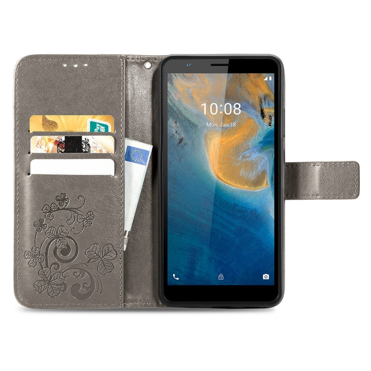 For ZTE Blade A31 Four-leaf Clasp Embossed Buckle Mobile Phone Leather Case