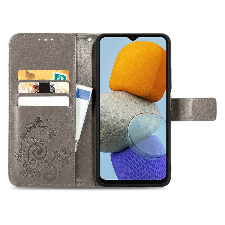 For Samsung Galaxy M23 Four-leaf Clasp Embossed Buckle Leather Phone Case