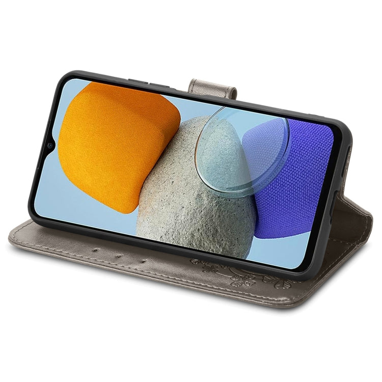 For Samsung Galaxy M23 Four-leaf Clasp Embossed Buckle Leather Phone Case