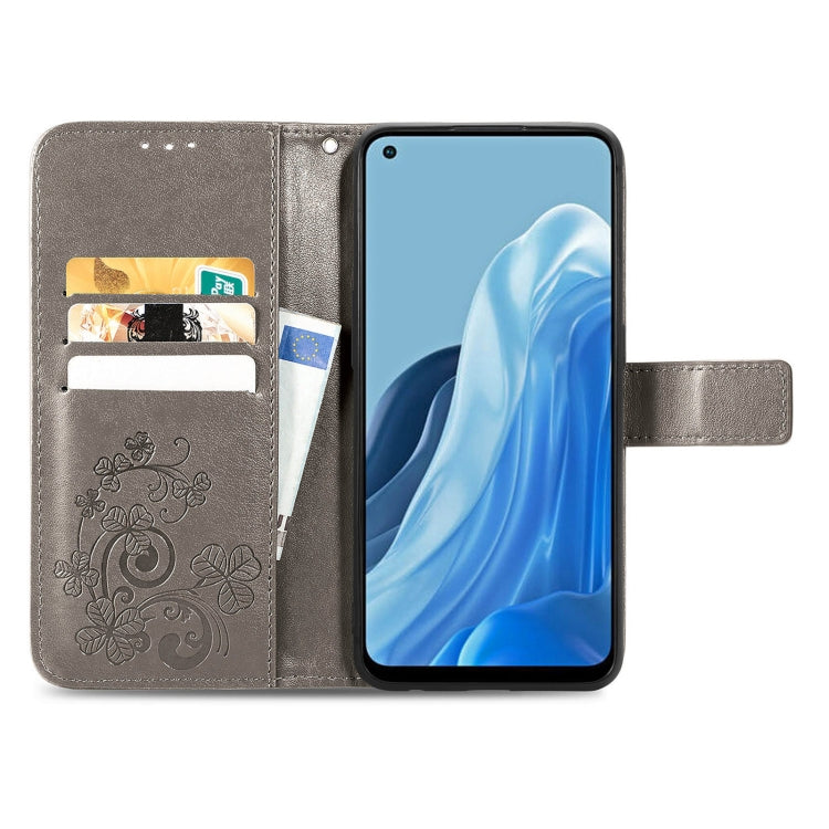 For OPPO Reno7 4G Four-leaf Clasp Embossed Buckle Leather Phone Case
