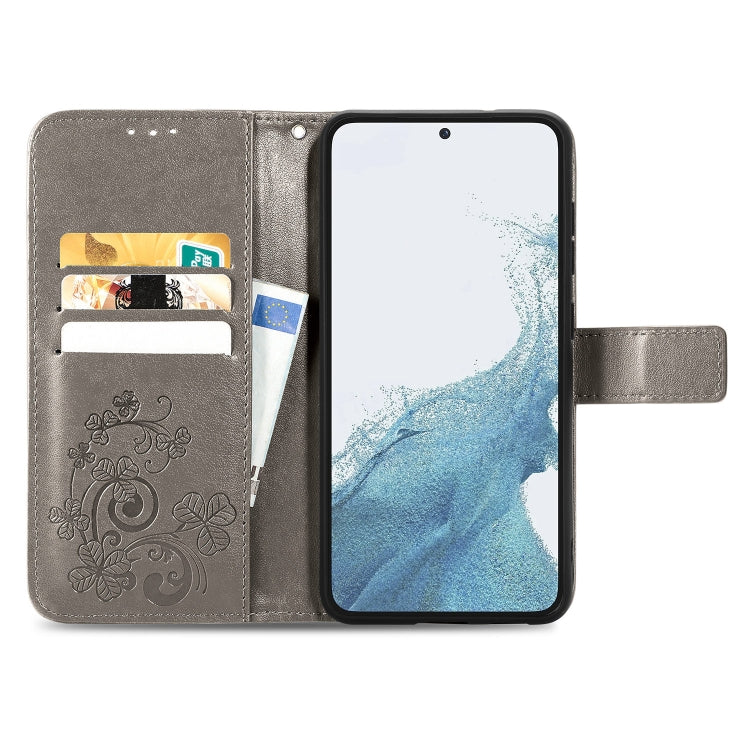 For Samsung Galaxy A04e Four-leaf Clasp Embossed Buckle Leather Phone Case