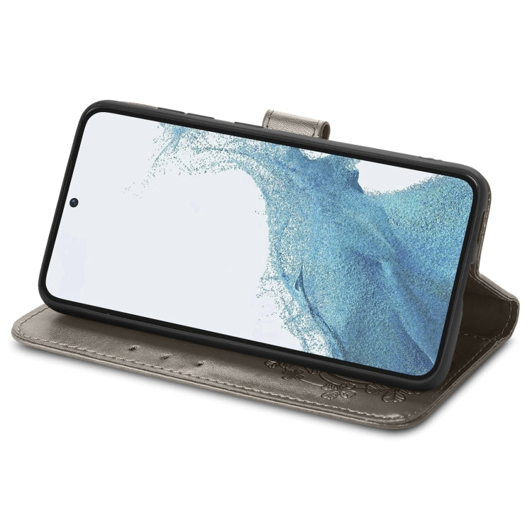For Samsung Galaxy A04e Four-leaf Clasp Embossed Buckle Leather Phone Case