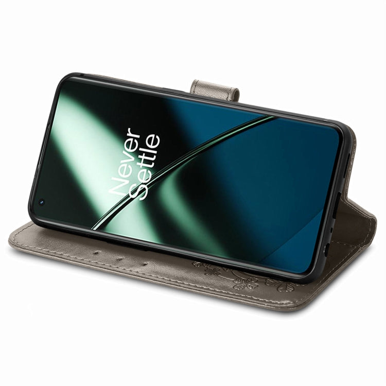 For OnePlus 11 Four-leaf Clasp Embossed Buckle Leather Phone Case