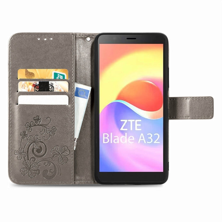 For ZTE Blade A32 Four-leaf Clasp Embossed Buckle Leather Phone Case