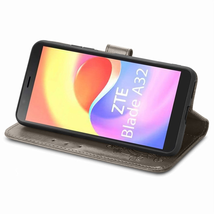 For ZTE Blade A32 Four-leaf Clasp Embossed Buckle Leather Phone Case