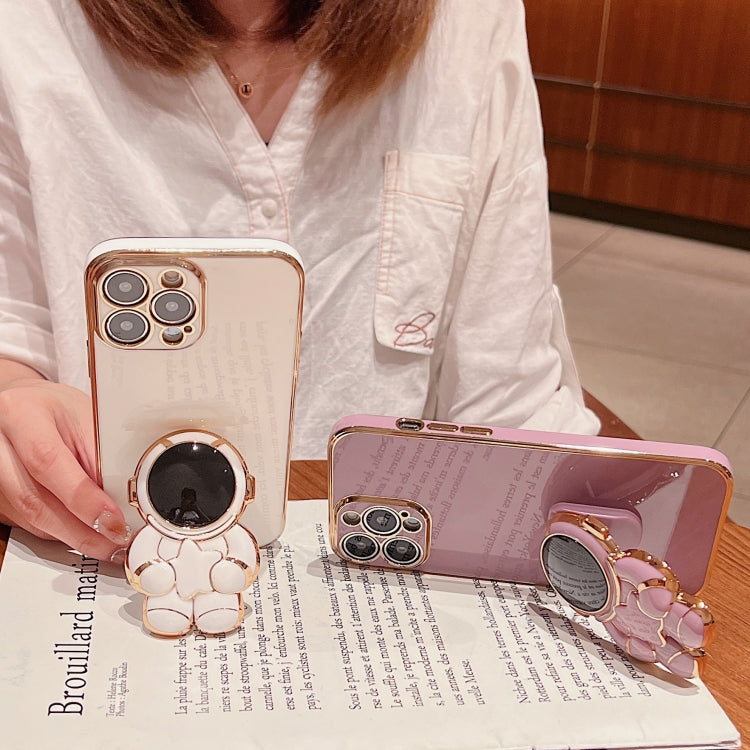 For iPhone 16 Embrace Stars Electroplating Astronaut Holder Phone Case