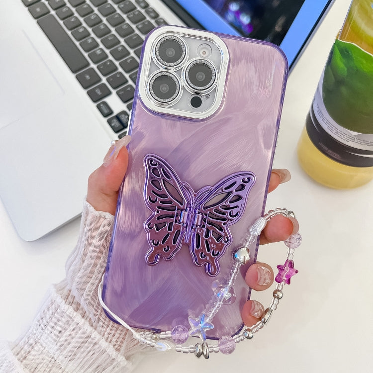 For iPhone 16 Pro Plating Glitter Lens Film Texture Butterfly Holder Wristband Phone Case