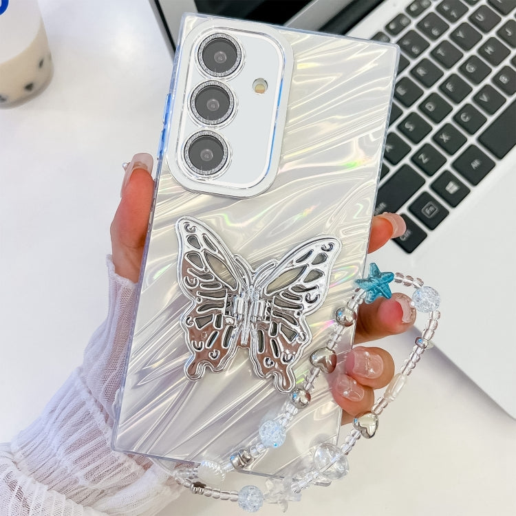 For Samsung Galaxy S25 5G Plating Glitter Lens Film Texture Butterfly Holder Wristband Phone Case