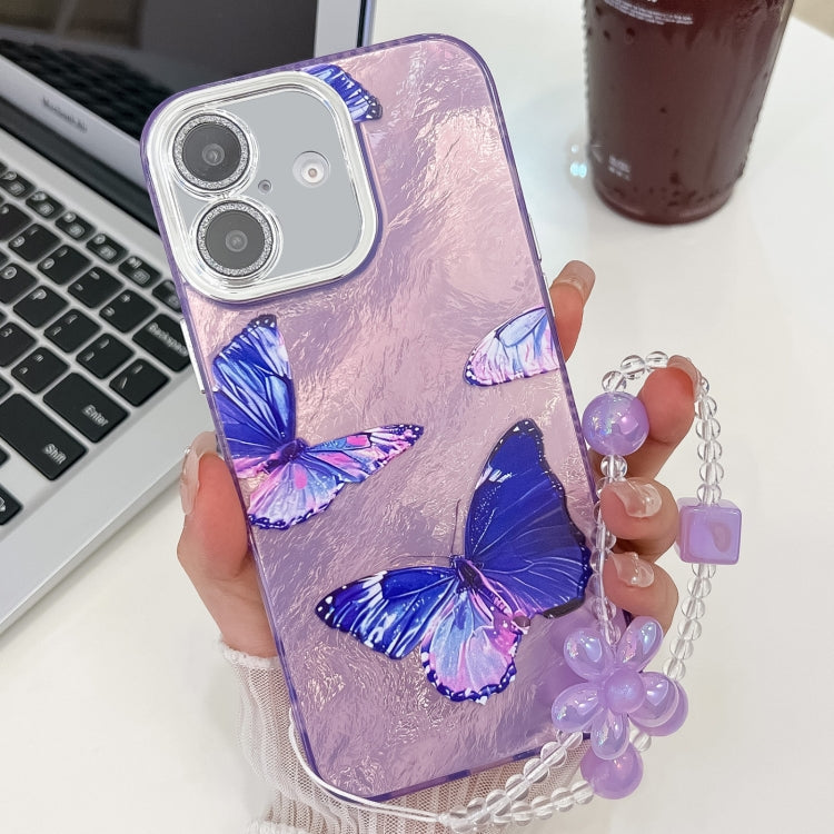 For iPhone 16 Plating Texture Butterfly Wristband TPU Phone Case with Glitter Lens Film
