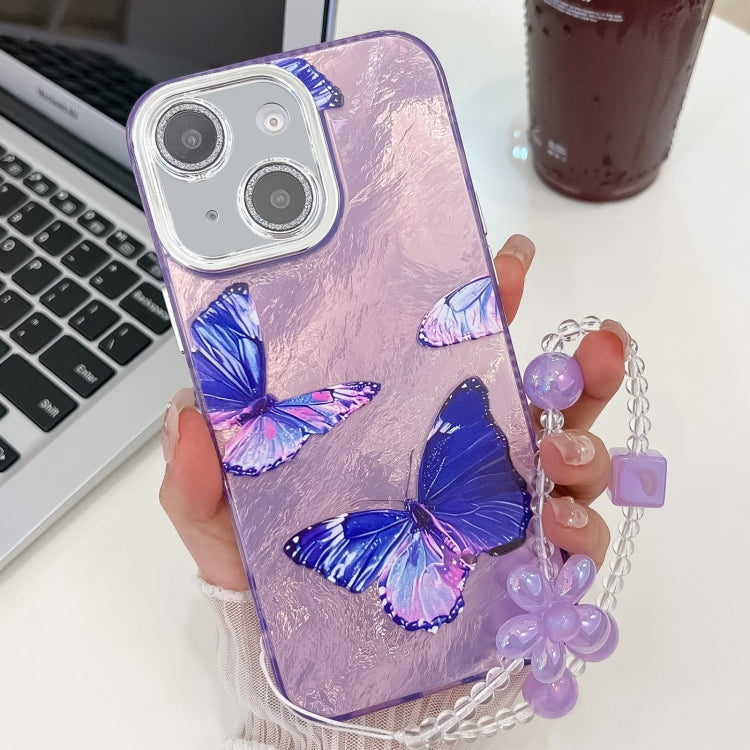 For iPhone 15 Plating Texture Butterfly Wristband TPU Phone Case with Glitter Lens Film