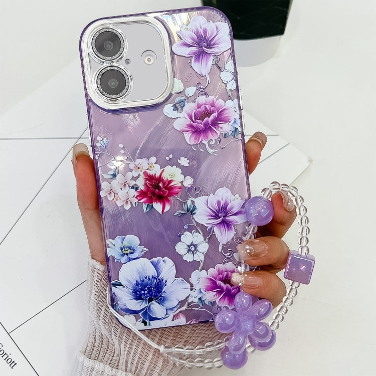 For iPhone 16 Plus Electroplating Flowers Plants Texture Wristband TPU Phone Case