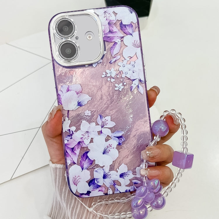 For iPhone 16 Plus Electroplating Flowers Plants Texture Wristband TPU Phone Case