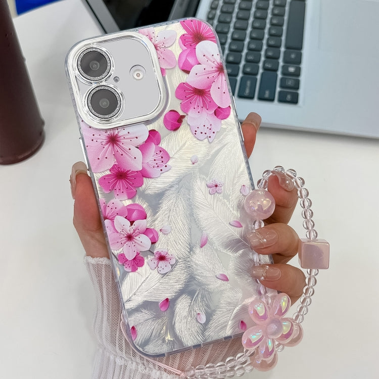 For iPhone 16 Plus Electroplating Flowers Plants Texture Wristband TPU Phone Case