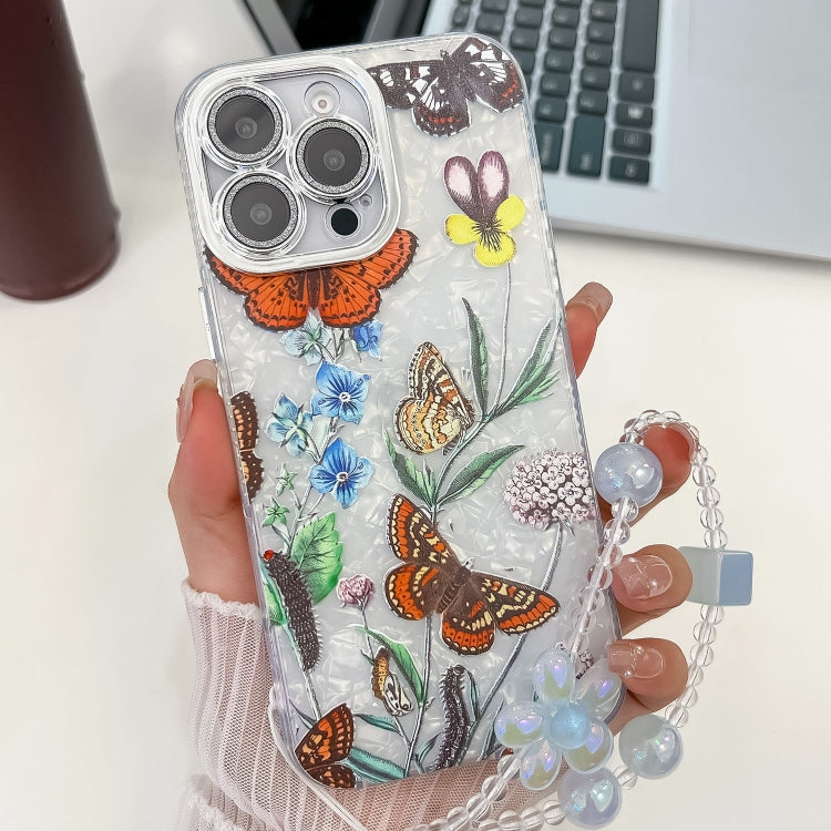 For iPhone 15 Pro Electroplating Flowers Plants Texture Wristband TPU Phone Case