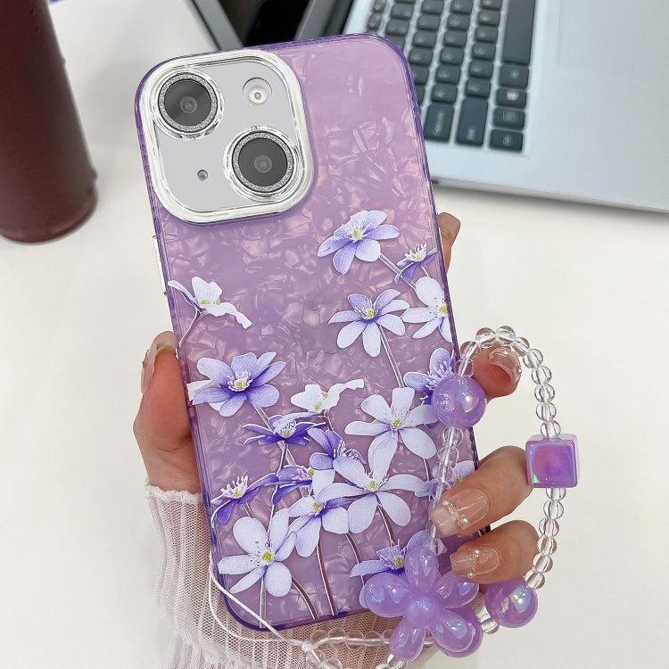 For iPhone 15 Electroplating Flowers Plants Texture Wristband TPU Phone Case