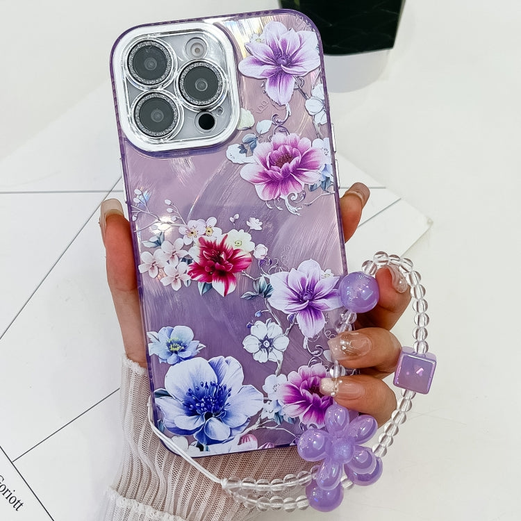 For iPhone 14 Pro Electroplating Flowers Plants Texture Wristband TPU Phone Case