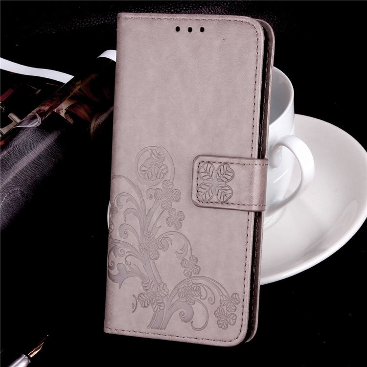 For Sony Xperia 20 Four-leaf Clasp Embossed Buckle Mobile Phone Protection Leather Case with Lanyard & Card Slot & Wallet & Bracket Function