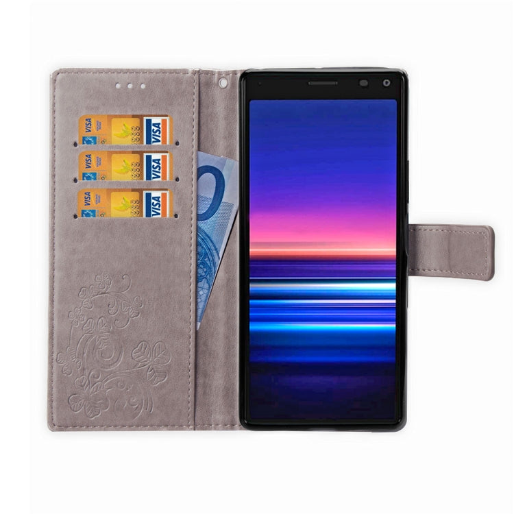 For Sony Xperia 20 Four-leaf Clasp Embossed Buckle Mobile Phone Protection Leather Case with Lanyard & Card Slot & Wallet & Bracket Function