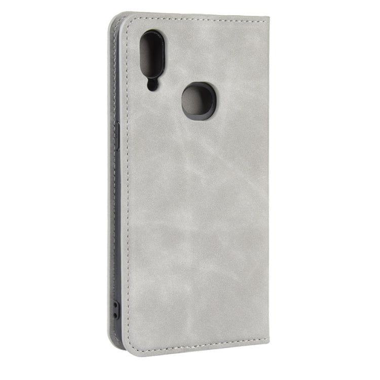 For Galaxy A10s Retro-skin Business Magnetic Suction Leather Case with Holder & Card Slots & Wallet