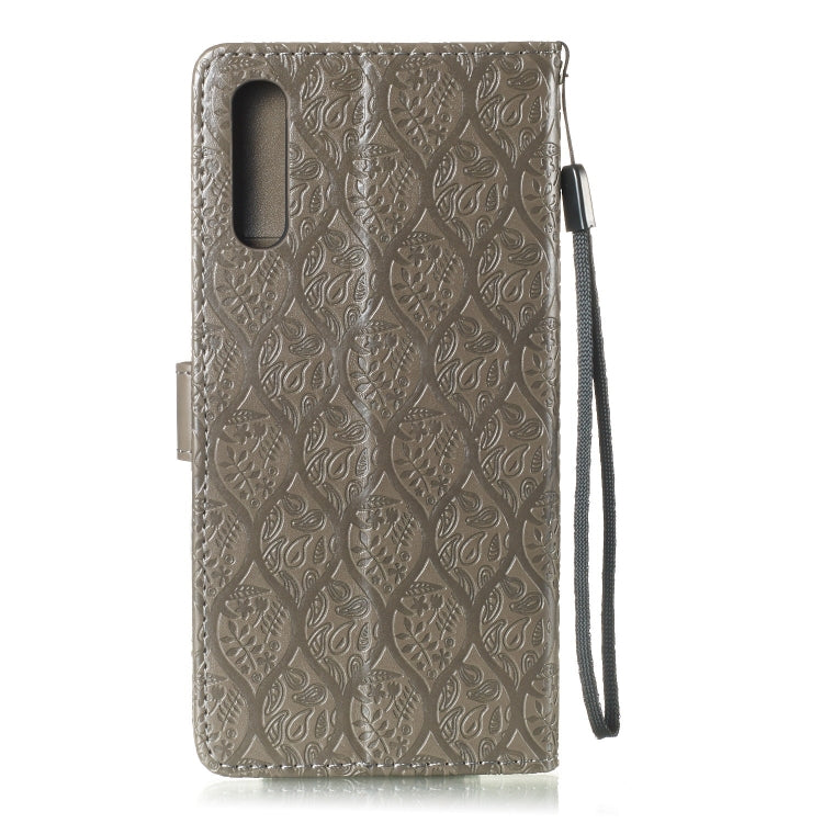 Pressed Printing Rattan Flower Pattern Horizontal Flip PU Leather Case for Galaxy A70, with Holder & Card Slots & Wallet & Photo Frame