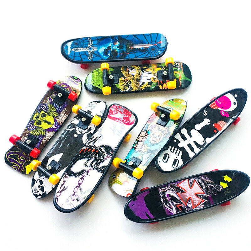 1pc Fingerboard Mini Creative Fingertips Skateboard Plastic Finger Skate .l8