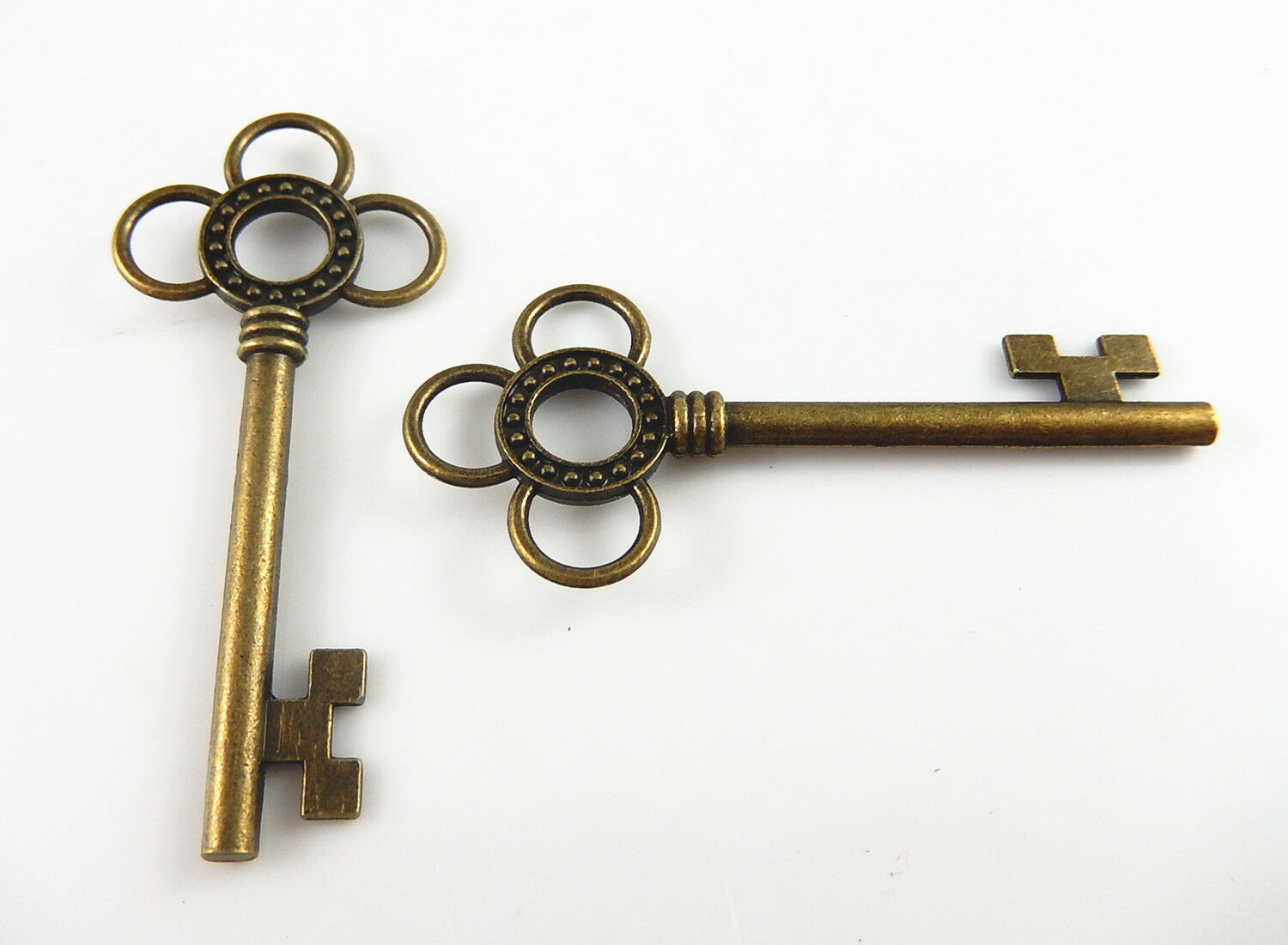 Lot of (x10) Antiqued Bronze Alloy Key Shaped Hollowed Flower Pendant 62x27 MM