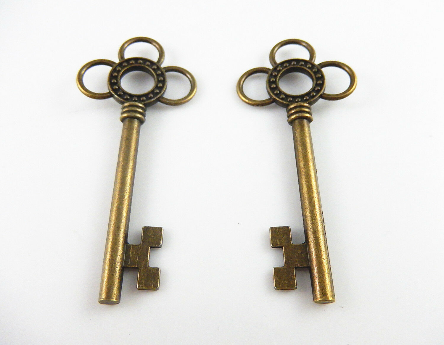 Lot of (x10) Antiqued Bronze Alloy Key Shaped Hollowed Flower Pendant 62x27 MM
